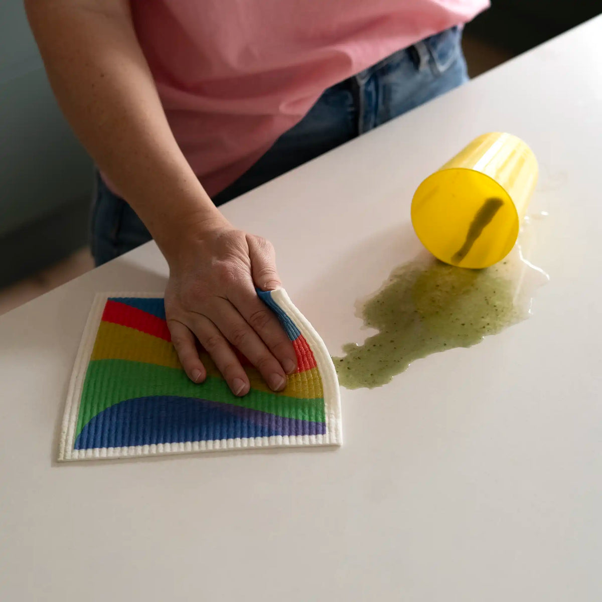 Kitchen Cloth Wiping Green Spill on Bench